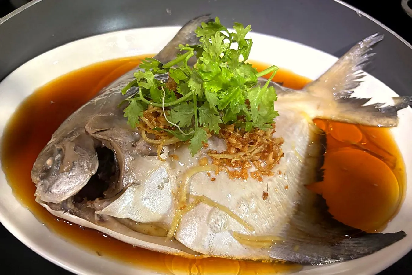 Steamed pomfret with ginger, fried garlic and coriander